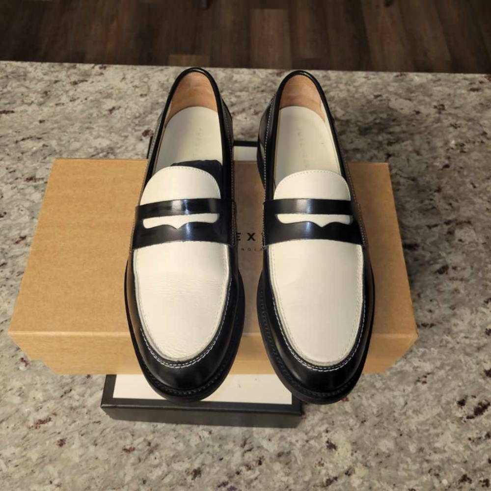 Black and White Loafers with Textured Upper and Decorative Strap